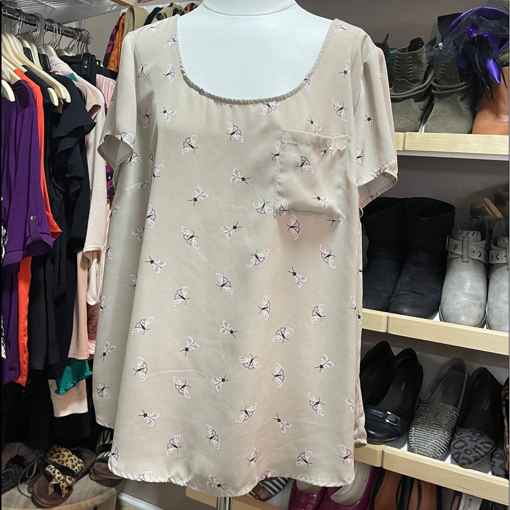 Short sleeve work top with cute little moths.